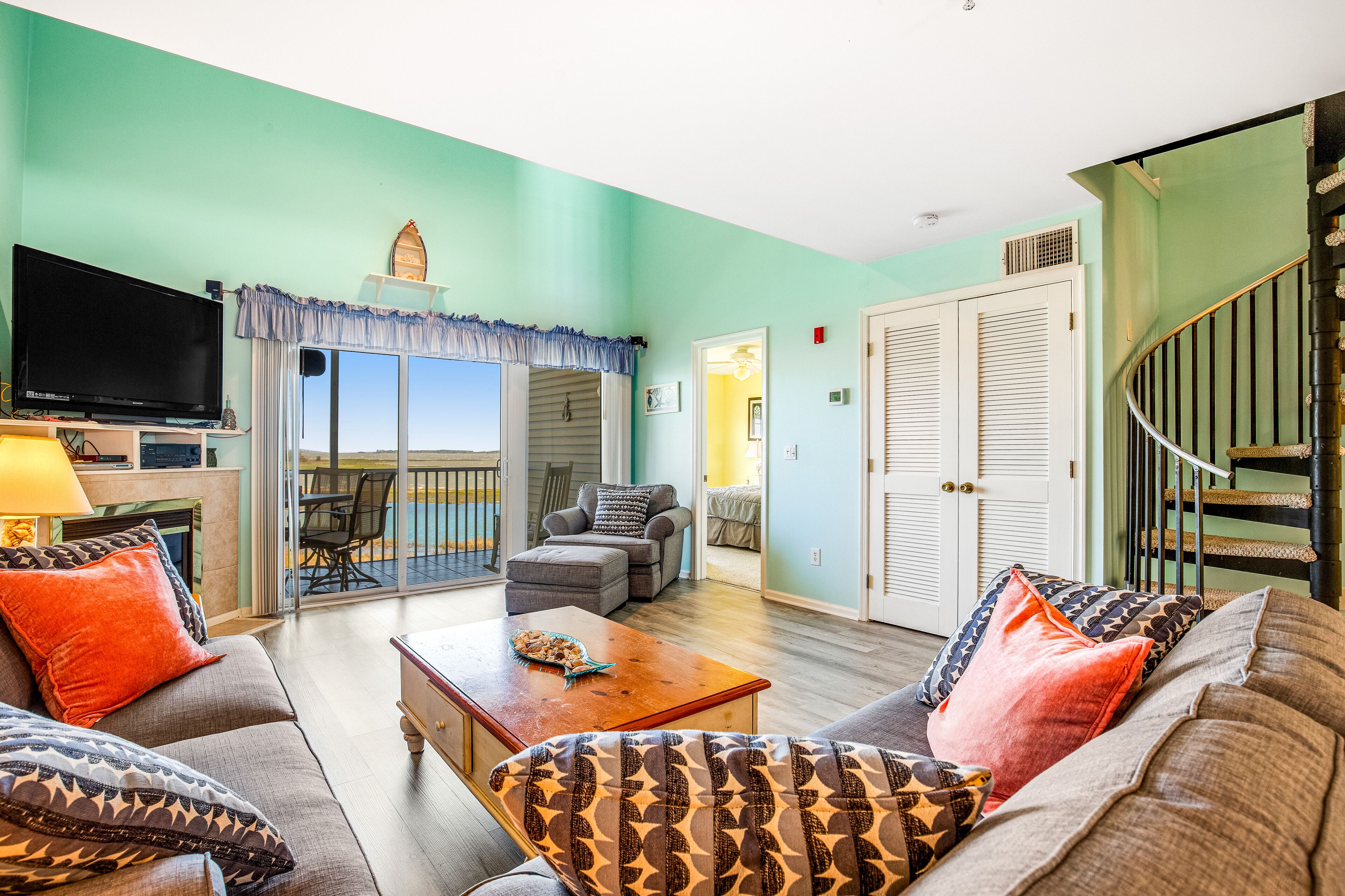 Bethany Bay condo with bay views, inviting deck/balcony, pools, golf, & beach