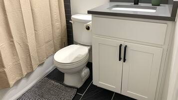 Combined shower/tub, towels, soap, shampoo