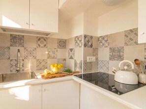 Fridge, microwave, toaster, cookware/dishes/utensils