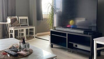 Apartment, 1 Bedroom, River View | Living area | TV