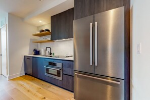 Enjoy cooking in this well-equipped kitchen with a double-door refrigerator and oven.