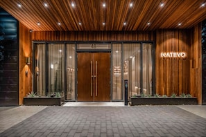Welcome to NATIVO, where a sleek entrance sets the tone for a stylish stay.