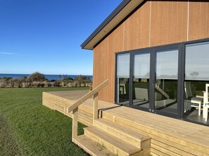 Property grounds - Panoramic views of the ocean close enough to the beach to hear the waves. (Toko Mouth)