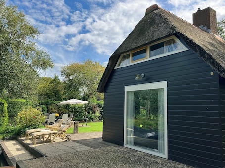 Terrace/patio. Idyllic house with spacious garden next to canal, boat rent is possible (extra)