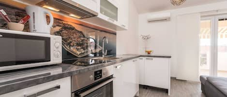 Apartment (One Bedroom Apartment with Balcony) | Private kitchen | Fridge