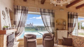 Family House, Multiple Bedrooms (Twilight Gozitan Farmhouse With Pool) | Living area | 21-inch flat-screen TV with cable channels