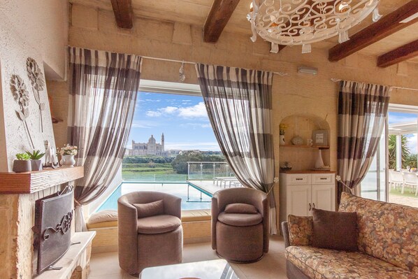 Family House, Multiple Bedrooms (Twilight Gozitan Farmhouse With Pool) | Living area | 21-inch flat-screen TV with cable channels