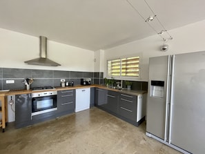 Enjoy cooking in this well-equipped kitchen with a gas stove, oven, and dishwasher.