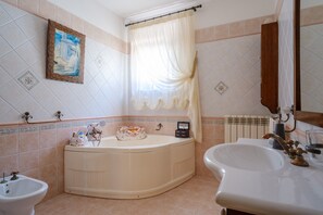 Bathtub, hair dryer, towels