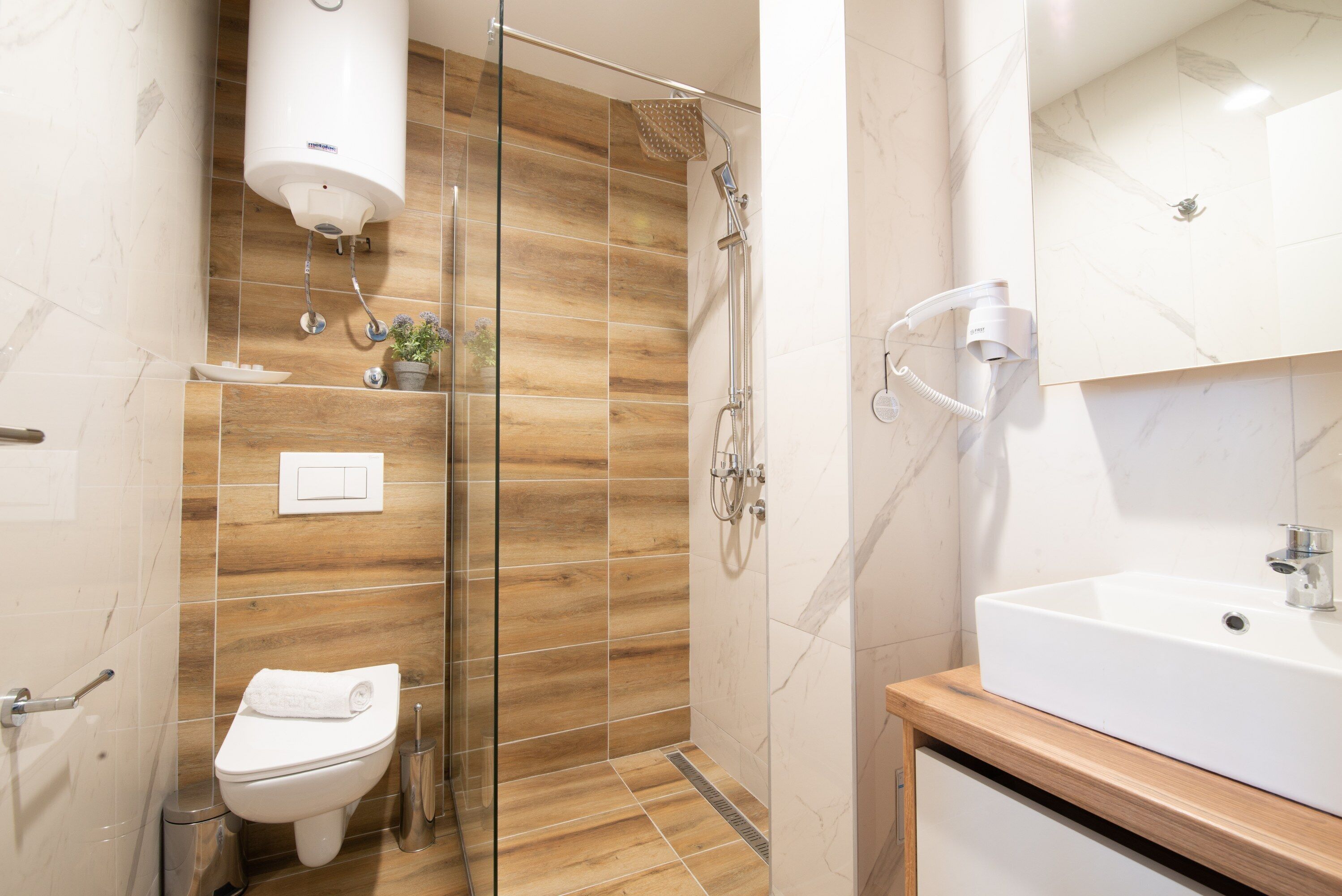 Shower, free toiletries, hair dryer, slippers