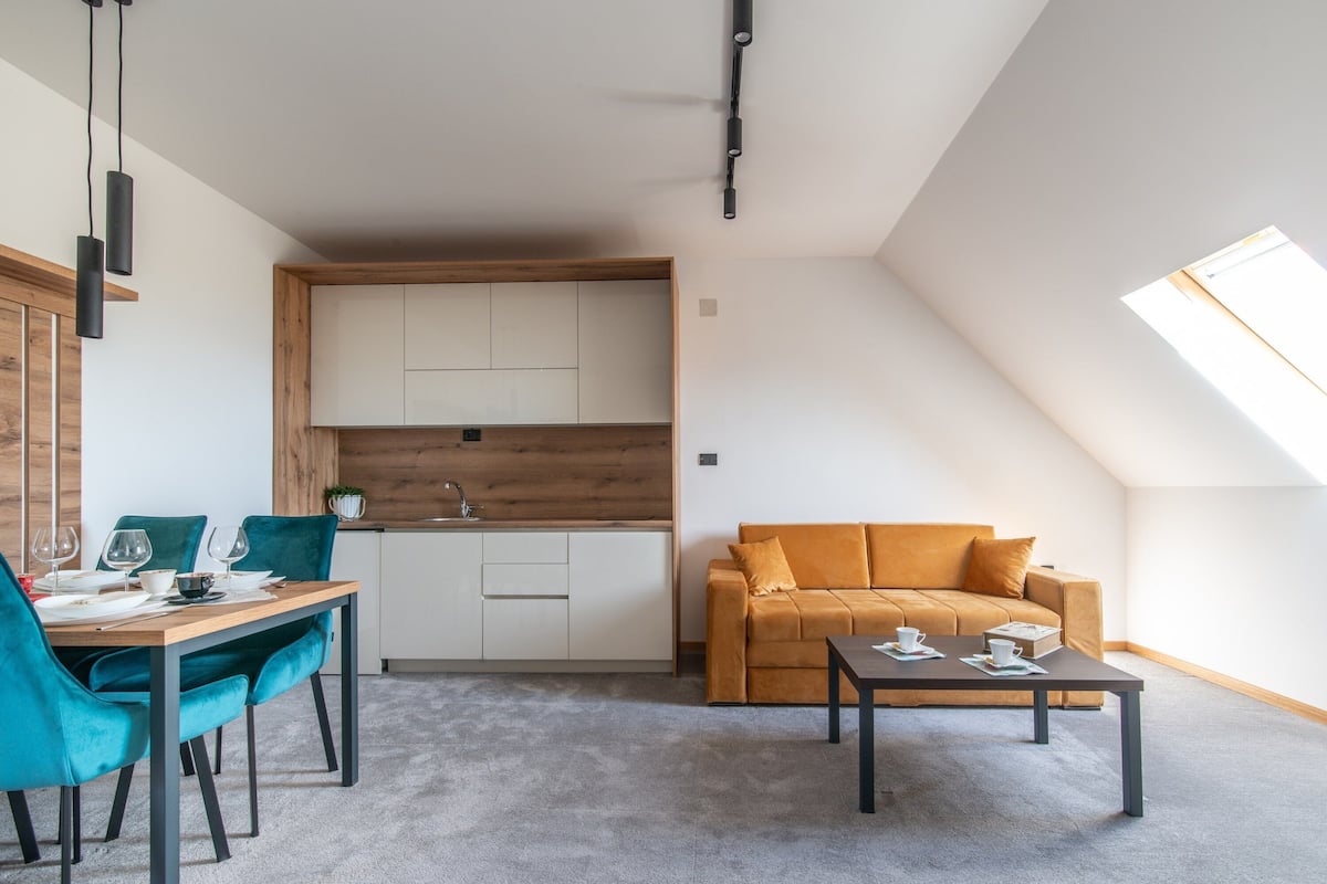 Executive Apartment | Living area | 80-cm plasma TV with satellite channels, TV