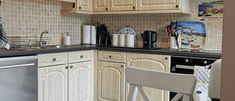 Fridge, microwave, oven, cookware/dishes/utensils