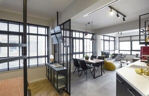 Deluxe Suite (Thea) | Living area | LED TV