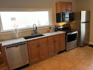 Fridge, microwave, oven, stovetop - Main, Three Bedroom House in Historic Loveland (Loveland)