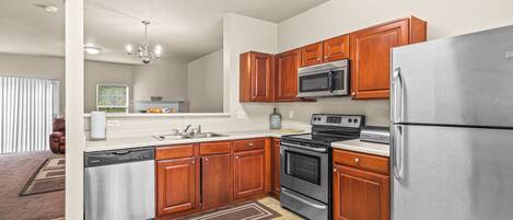 Fridge, microwave, stovetop, cookware/dishes/utensils