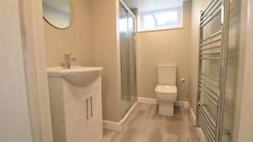 Shower, free toiletries, towels, toilet paper