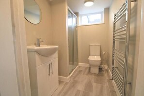 Shower, free toiletries, towels, toilet paper