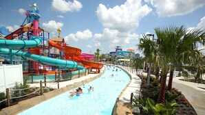 A water park with multiple slides and pools. - 5br/5ba/5mi Disney • Heated Pool/SPA • Free Uber rides to parks! (Kissimmee)
