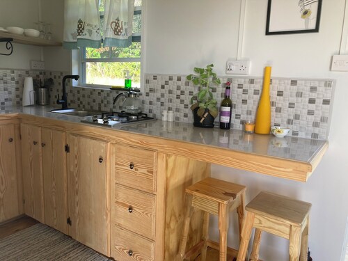 ComfyCabin is rustic with modern amenities, has deck with great view. Peaceful.