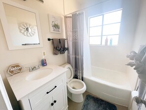 Combined shower/bathtub, hair dryer, towels, toilet paper