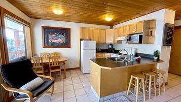 Fridge, coffee/tea maker, cookware/dishes/utensils