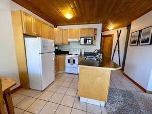 Fridge, coffee/tea maker, cookware/dishes/utensils