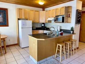 Fridge, coffee/tea maker, cookware/dishes/utensils