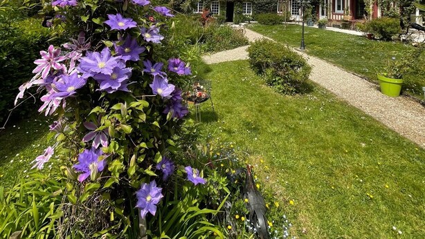 A traditional thatched-roof house with a garden path leading to it. - la Fontaine Romy (Genneville)