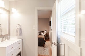 Combined shower/tub, hair dryer, towels, soap