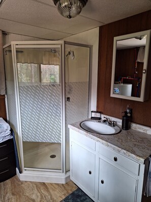 Shower, hair dryer, towels, soap
