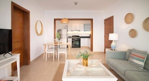 Apartment | Living area | 50-inch Smart TV with cable channels, TV, Netflix