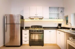 Apartment | Private kitchen | Full-size fridge, microwave, oven, coffee/tea maker