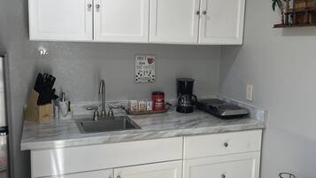 Fridge, microwave, coffee/tea maker, toaster