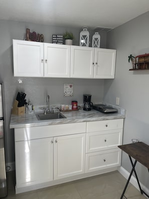 Fridge, microwave, coffee/tea maker, toaster
