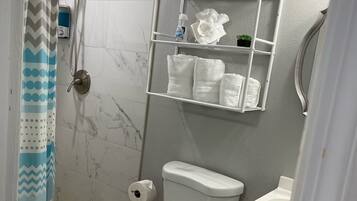 Shower, hair dryer, towels, soap