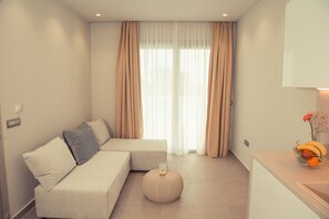 One bedroom Suite with private hot tub | Living area | 43-inch Smart TV with cable channels, TV