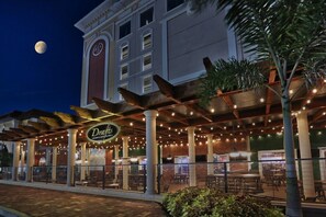 Enjoy dining under the stars at Drafel's Sports Bar & Grill, where tables and chairs are arranged for a comfortable meal.