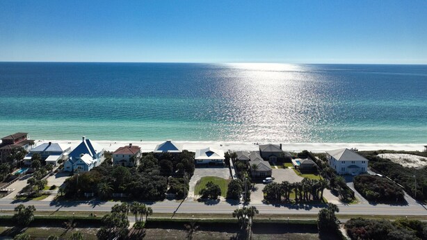 A coastal property with a beach view, multiple houses, and a clear sky. - Snowbird Specials-2 Minute Walk Private Beach-3 Pools - Gulf Place (Santa Rosa Beach)