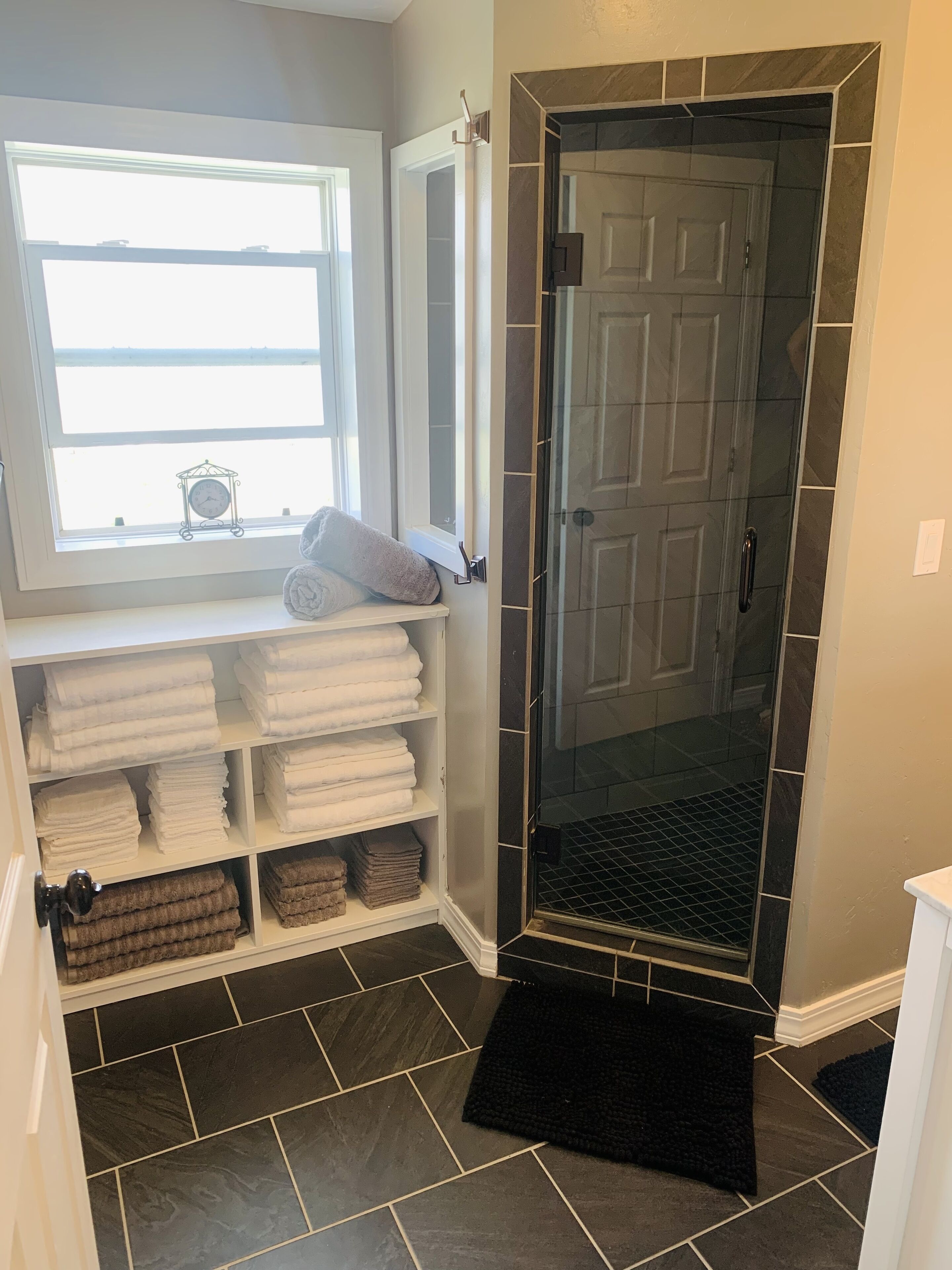 Combined shower/tub, hair dryer, towels, soap