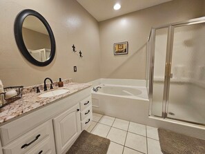 Combined shower/tub, hair dryer, towels, soap