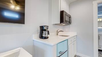 Microwave, coffee/tea maker, cookware/dishes/utensils