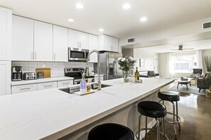 Newly renovated kitchen with HUGE island; open and bright
