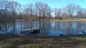 A dock with a small shed and a fishing rod. - Primitive campsites, pond, wildlife, campfires (West Frankfort)