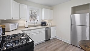 A kitchen with white cabinets, a stainless steel refrigerator, a microwave, a stove, and a dishwasher. - Family and dog friendly☆3BR house☆Porch swing☆Mars☆PGH☆Cranberry (Mars)