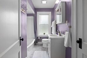 Combined shower/tub, hair dryer, towels, soap