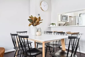Enjoy meals in this stylish dining area with a large table and comfortable seating for six.