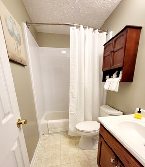 Combined shower/bathtub, hair dryer, towels, soap