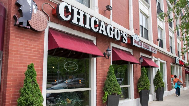 A brick building with a red awning and a sign that reads "CHICAGO'S HOME OF CHICKEN & Waffles". - Cozy 1-2 BR APT w/fireplace & Patio/Deck (Chicago)