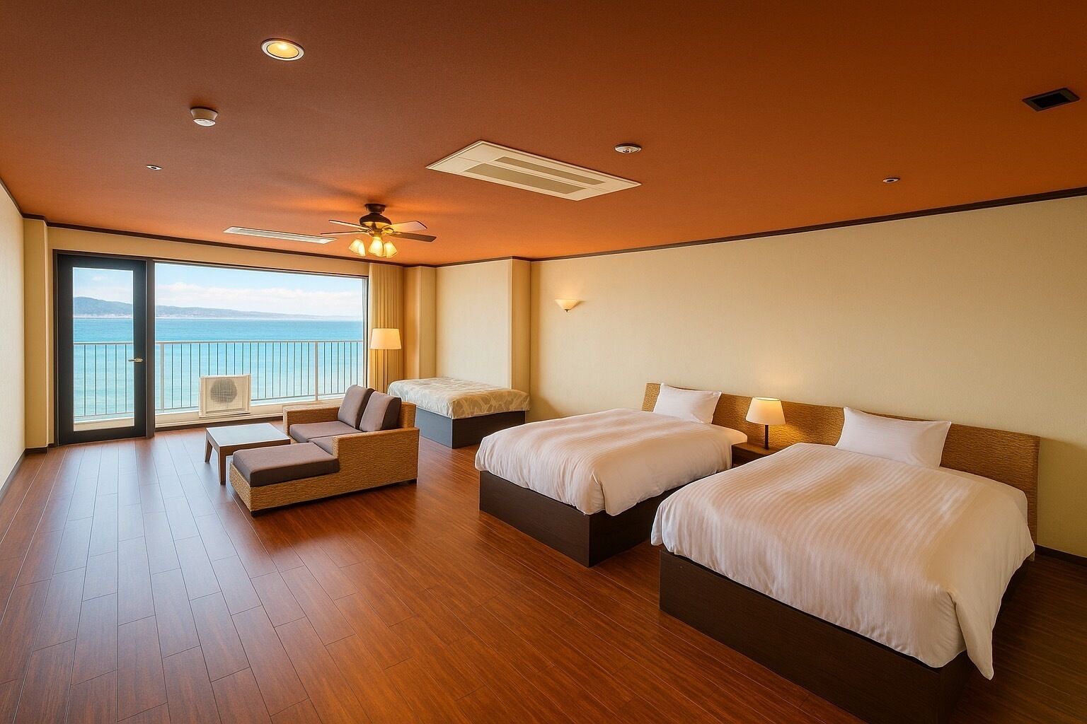 A hotel room with two beds, a balcony with a view, a ceiling fan, and a large window.