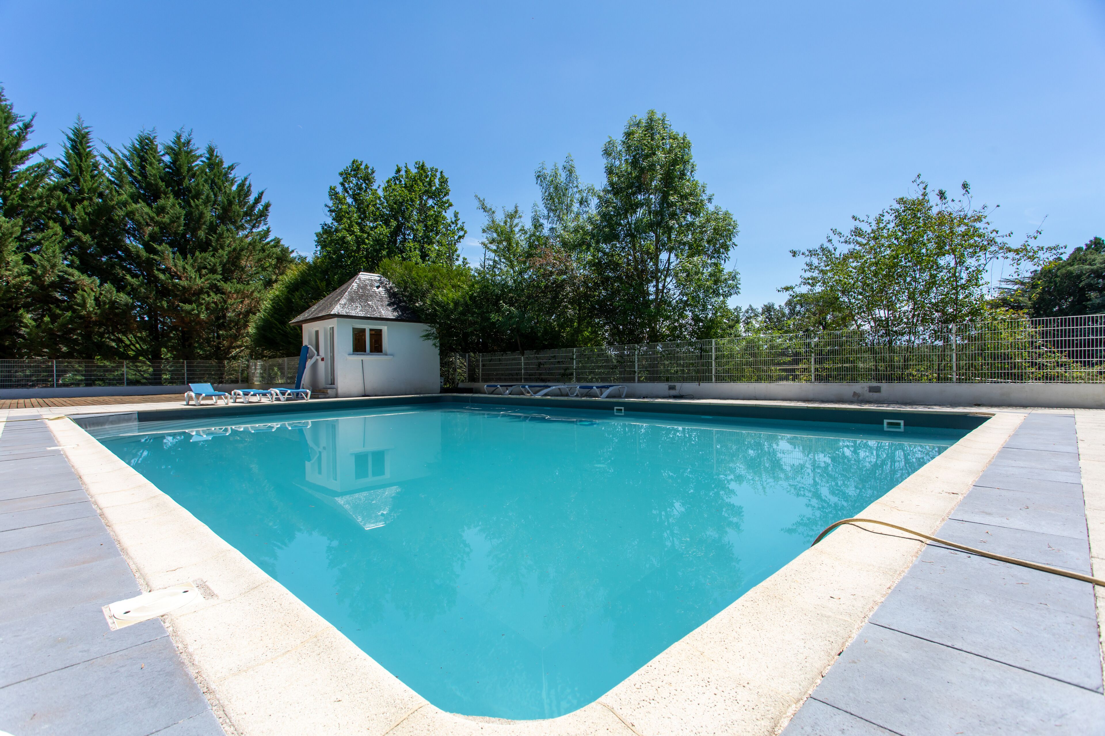 Seasonal outdoor pool, pool loungers